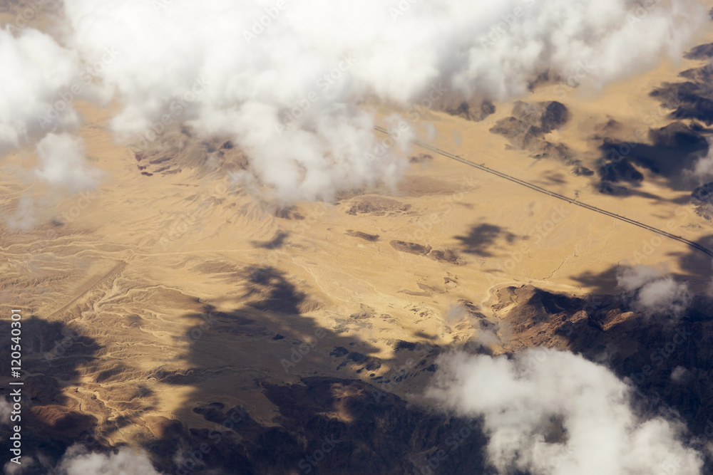 Fototapeta premium Aerial view of clouds over the land, the landscape. The texture of the scenic sky and desert Sands in the United States. 