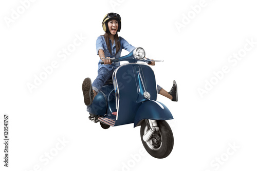 Asian woman riding scooter