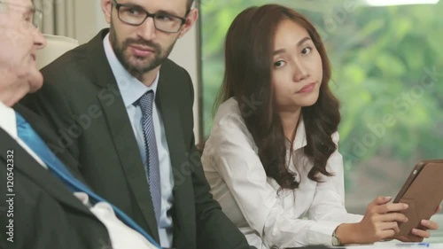 Businesswoman Feeling Bored at Meeting photo