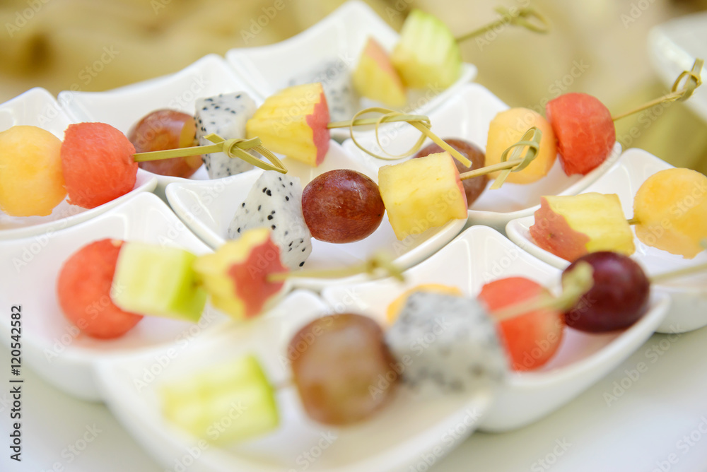 Different fresh fruit arranged for healthy vegetarian buffet or dessert Different fresh fruit arranged for healthy vegetarian buffet or dessert