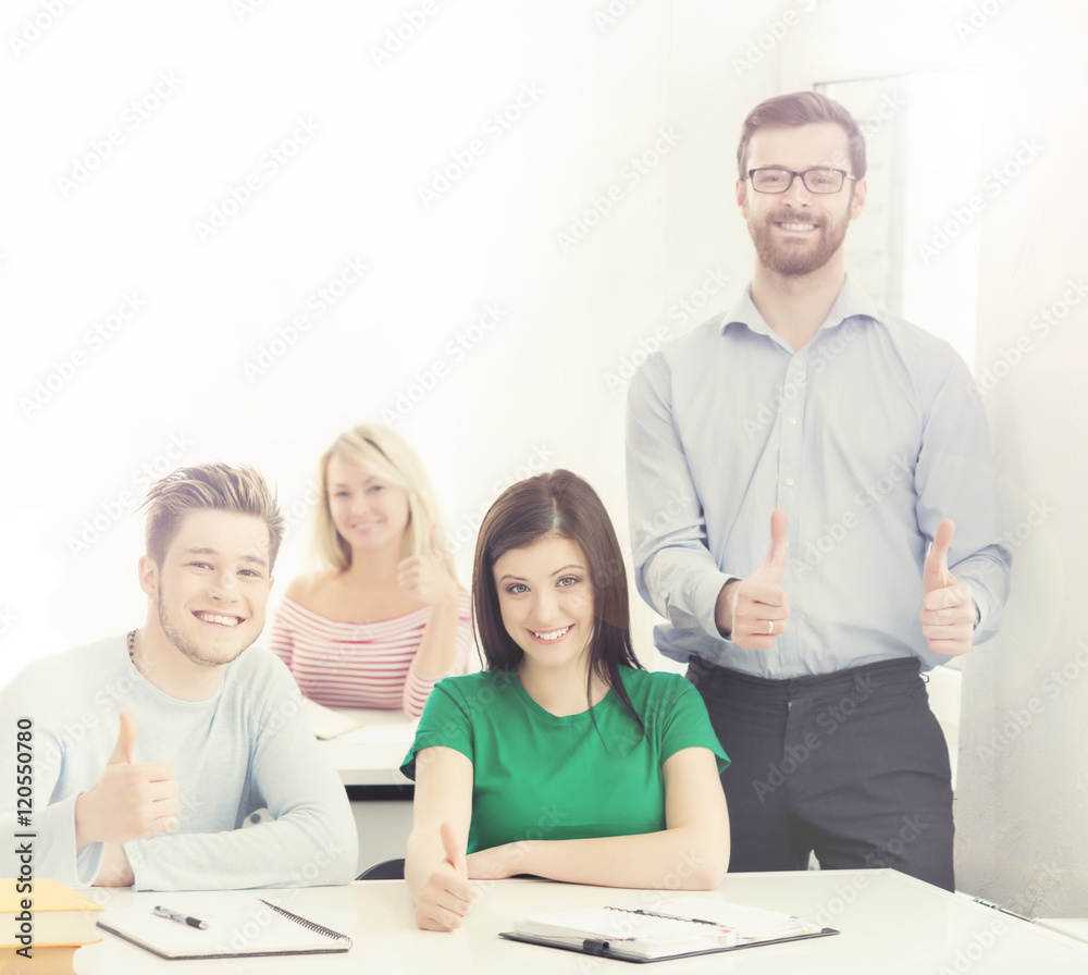 Fototapeta premium Group of teenage students and a teacher at the lesson