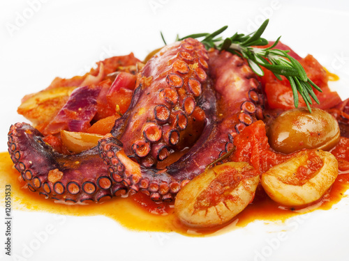 Octopus with tomato sauce and olives, one portion, isolated on w