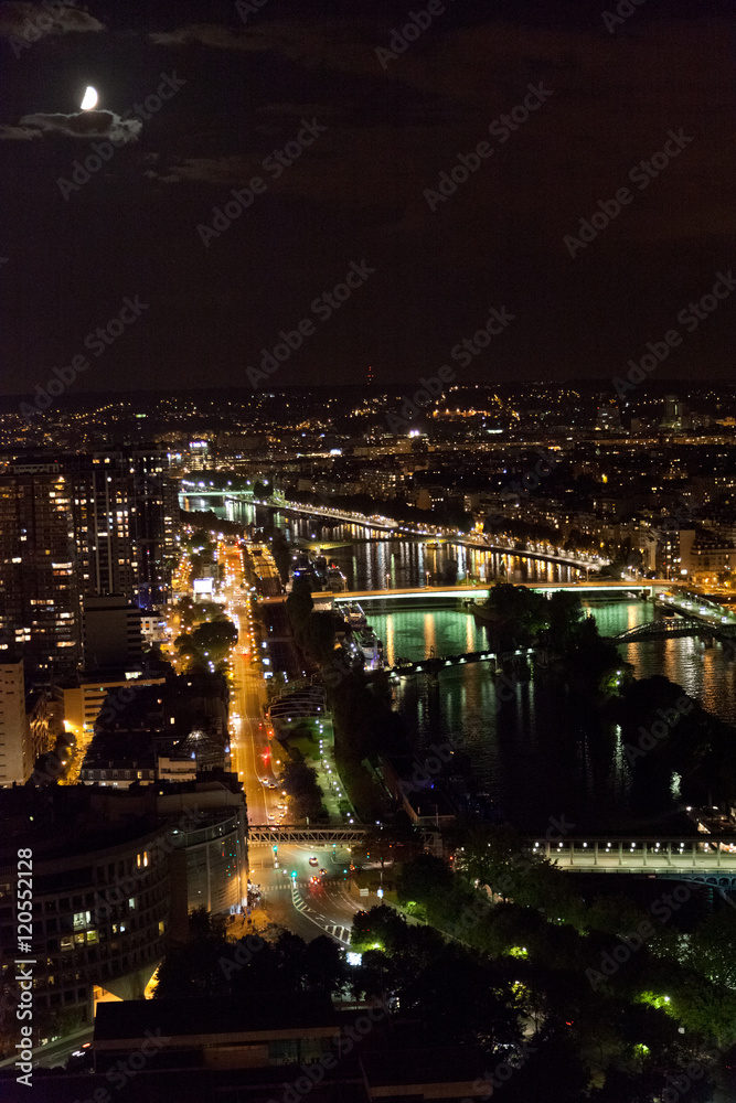 View from the Eiffel Tower at night. River and bridges in the fr