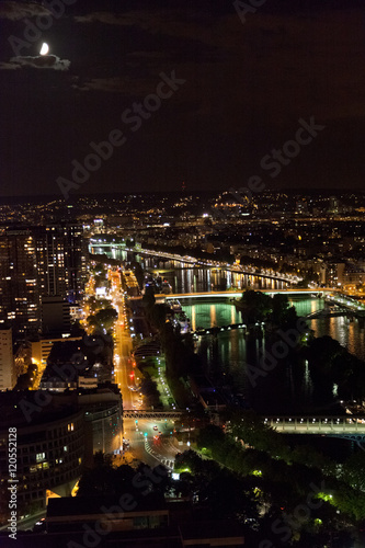 View from the Eiffel Tower at night. River and bridges in the fr