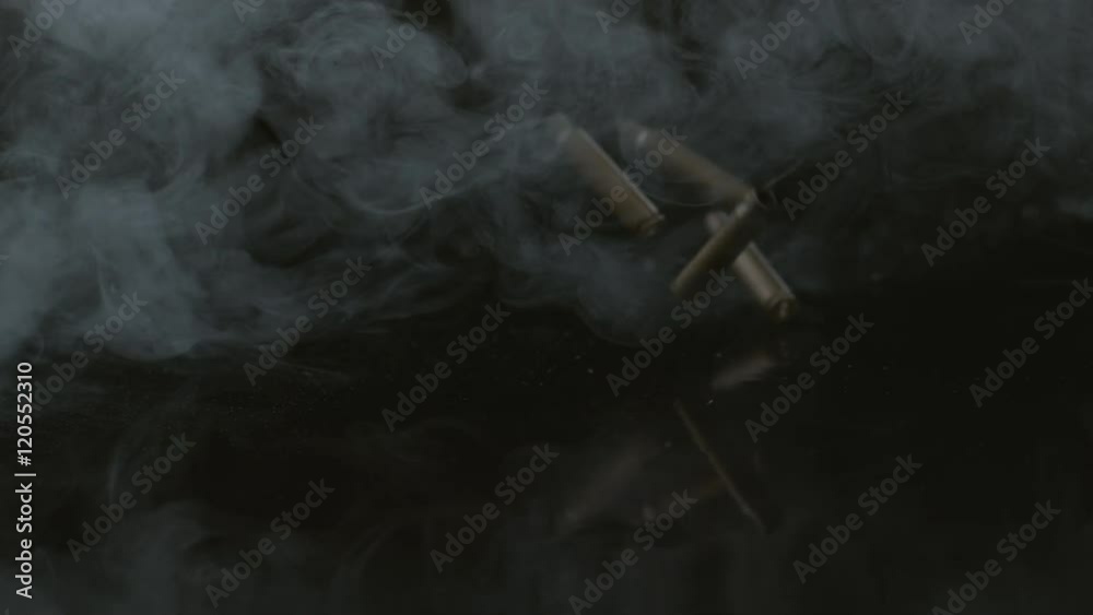Bullet shells and smoke falling in slow motion; shot on Phantom Flex 4K at 1000 fps