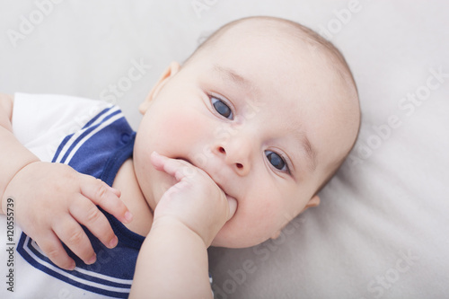 Newborn Baby Boy Laying Down Sucking His Fingers