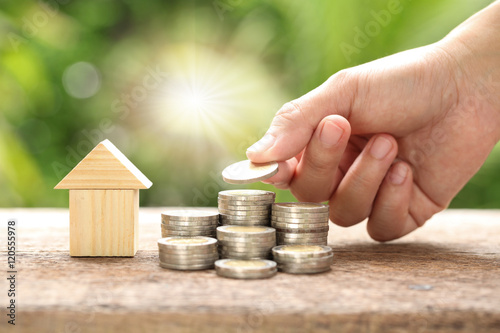 Slika na platnu House and coins stack. The concept of purchase of habitation, bu