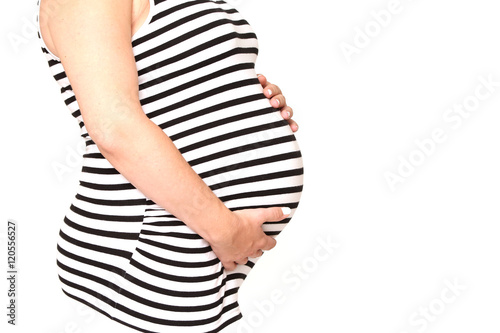pregnant woman wearing a sailor and hugging her belly with love