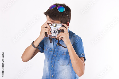 young boy with vintage photo camera