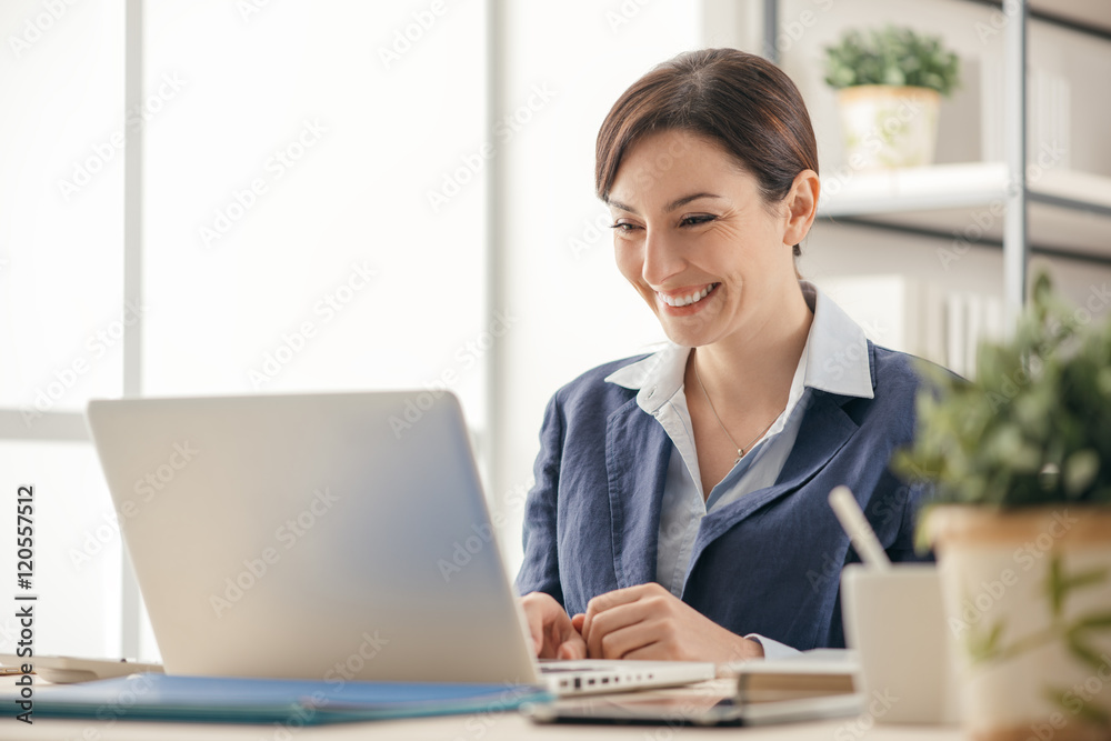Cheerful businesswoman in her office Cheerful businesswoman in her office
