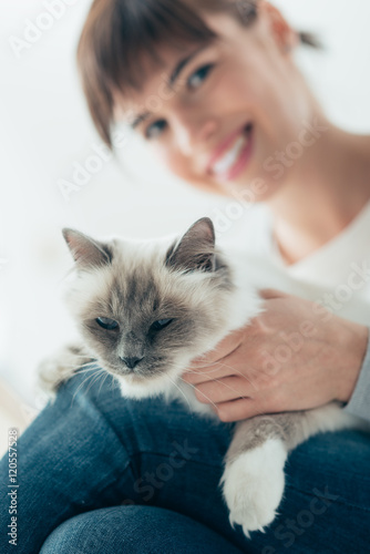 Fototapeta Naklejka Na Ścianę i Meble -  Woman caressing her birman cat