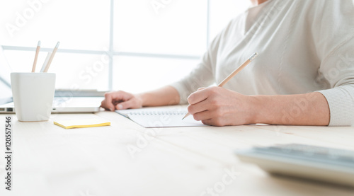 Young designer sketching on a notepad