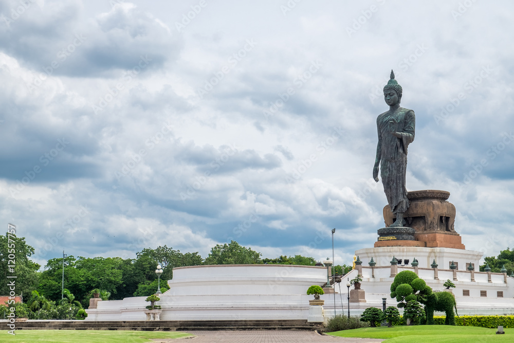 Buddha statue beside in decorated garden at phutthamonthon,nakhon pathom,thailand