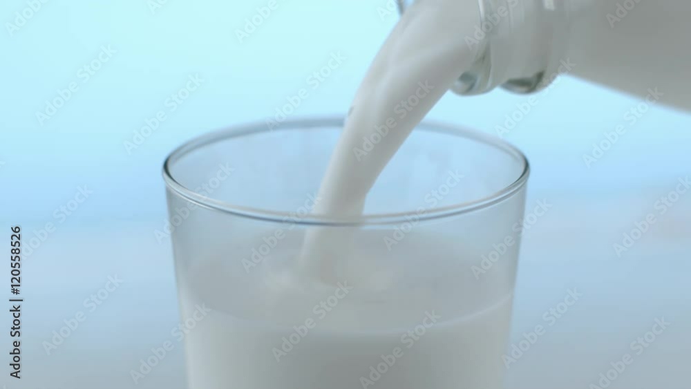 Milk pouring and splahsing in slow motion; shot on Phantom Flex 4K at 1000 fps Milk pouring and splahsing in slow motion; shot on Phantom Flex 4K at 1000 fps