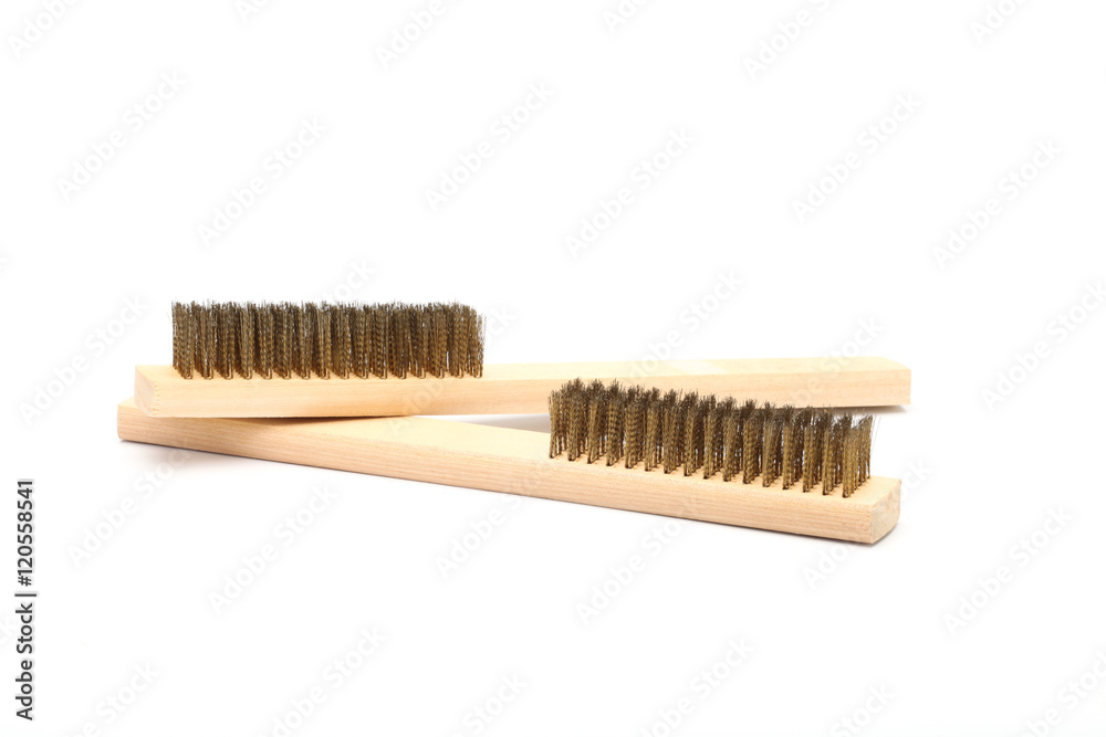 Close-up Brass brush with wooden handle isolated on white backgr Close-up Brass brush with wooden handle isolated on white backgr