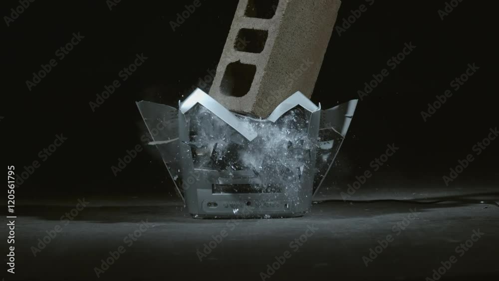 Concrete block is dropped on television in slow motion; shot on Phantom Flex 4K at 1000 fps