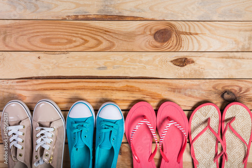 shoes on brown wooden floor standing in line
