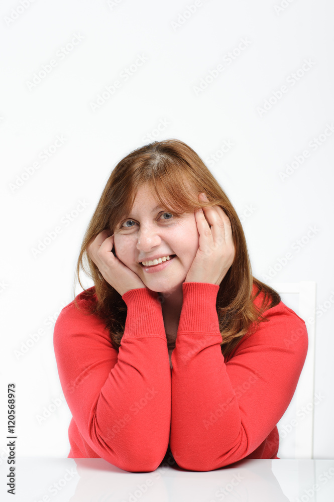 Portrait of a charming middle-aged woman with a smile on her fac Portrait of a charming middle-aged woman with a smile on her fac
