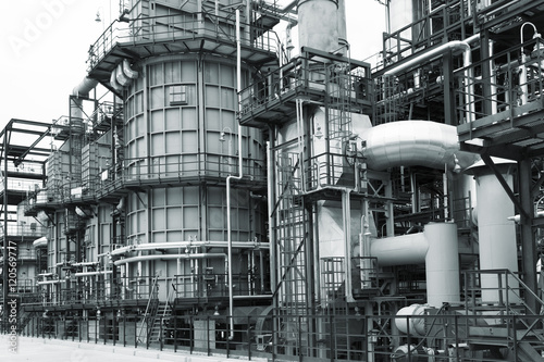 Close-up of pipelines and destillation tanks of an oil-refinery plant