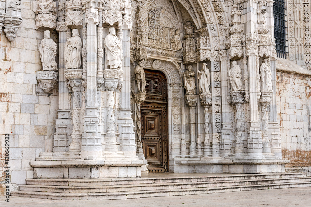 St. Mary, kings, sailors and navigators statues over the entrance to the Monastery Jeronimos. Lisbon, Portugal.