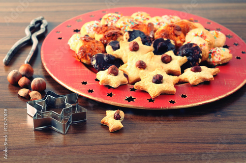 Christmas cookies on plate with nutes. advent time. photo