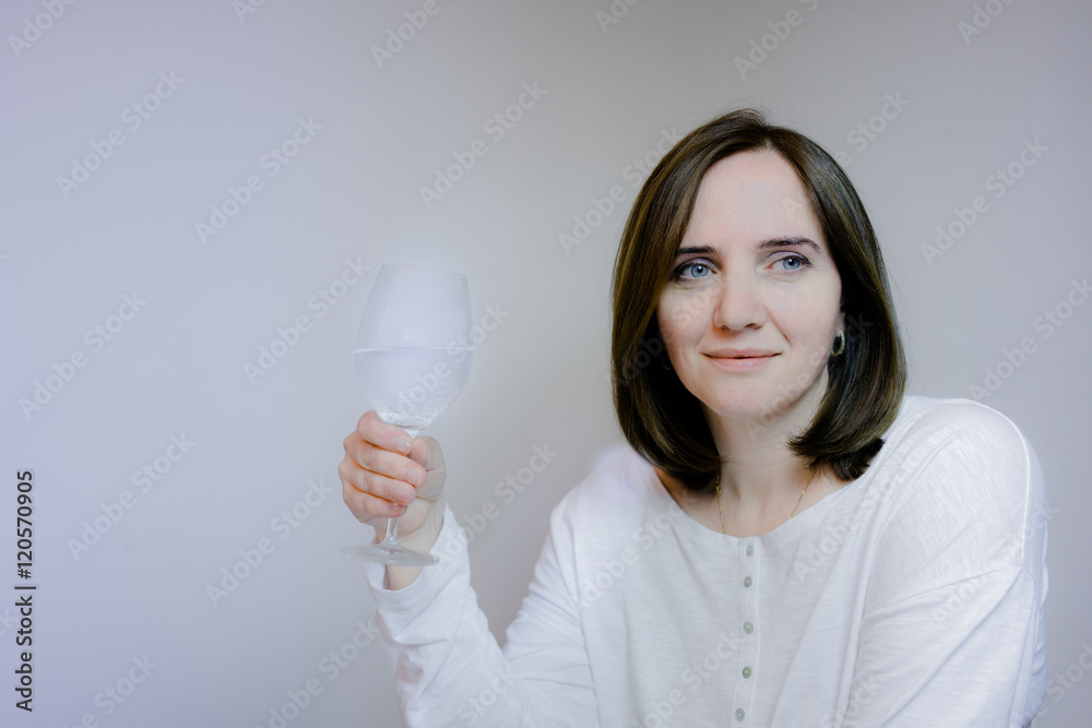 life style. lady. Pretty smiling middle-aged woman holding a glass of mineral water life style. lady. Pretty smiling middle-aged woman holding a glass of mineral water