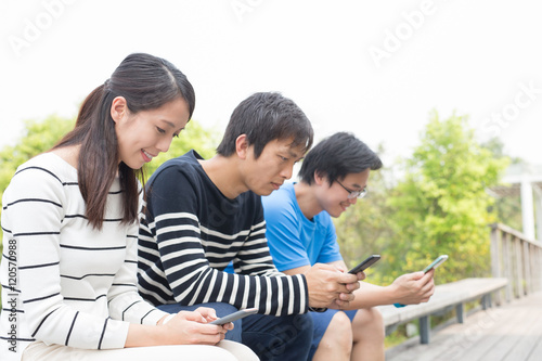 people stake smart phone together