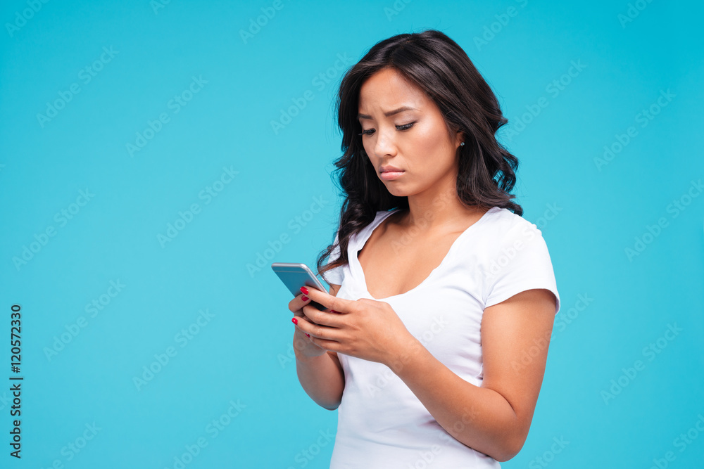Sad gloomy asian woman using smartphone Sad gloomy asian woman using smartphone