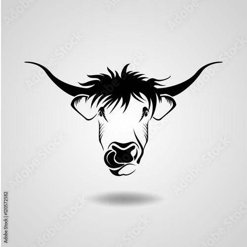 black silhouette of a bull with big horns and funky hairstyle, which shows the tongue