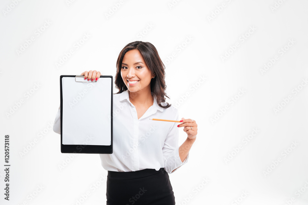 Smiling young asian businesswoman pointing pencil at blank clipboard Smiling young asian businesswoman pointing pencil at blank clipboard