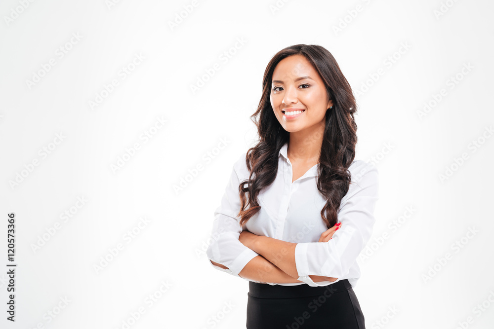 Smiling pretty young asian businesswoman standing with arms crossed Smiling pretty young asian businesswoman standing with arms crossed
