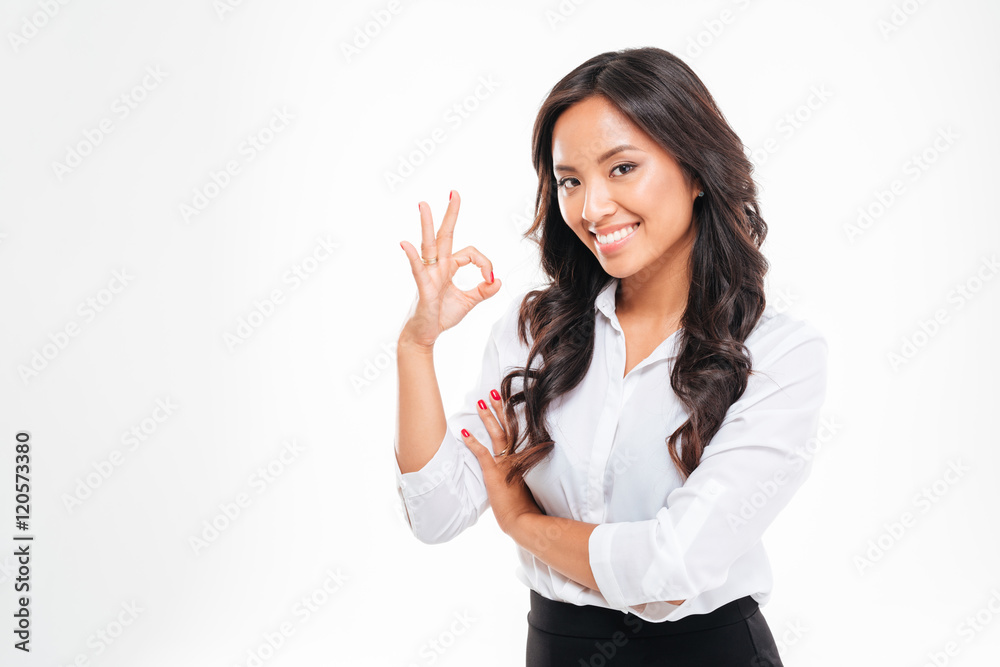 Happy young asain businesswoman showing ok sign isolated Happy young asain businesswoman showing ok sign isolated