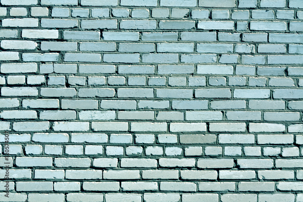 Fototapeta premium Weathered cyan toned brick wall texture.