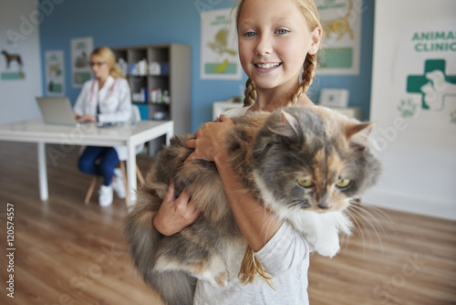 Portrait of a girl with her cat.