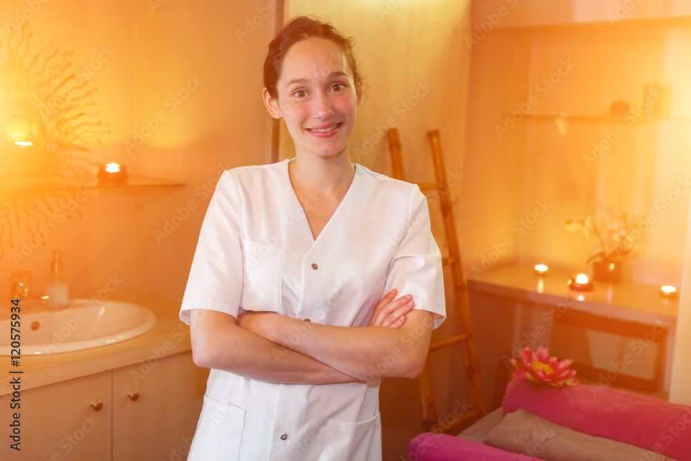 Portrait of a young attractive masseuse in a zen room Portrait of a young attractive masseuse in a zen room
