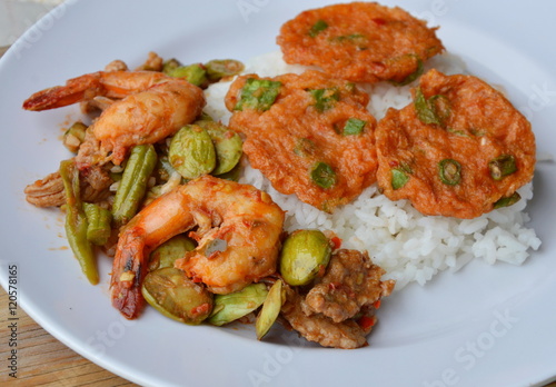 fried fish patty and spicy stir fried bitter flat bean with shrimp on rice