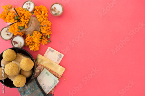 Hindu festival of lights, Dusshera and Diwali preparation and celebration ingredients- sweets, flowers, lights, cash, bell and splash cymbals and incense sticks