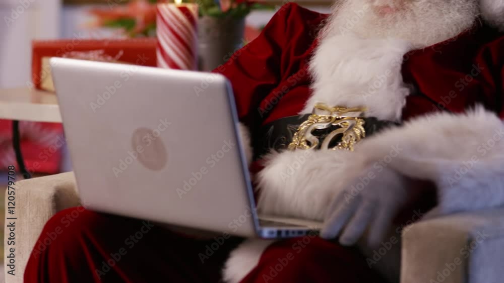 Santa Claus using laptop, closeup Santa Claus using laptop, closeup