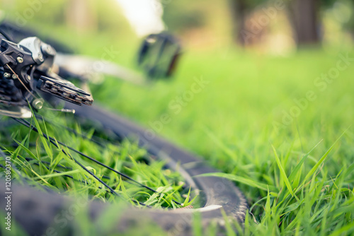 Soft focus of mountain bike gears on green grass background