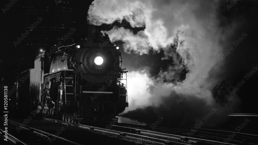 Steam locomotive at night in black and white