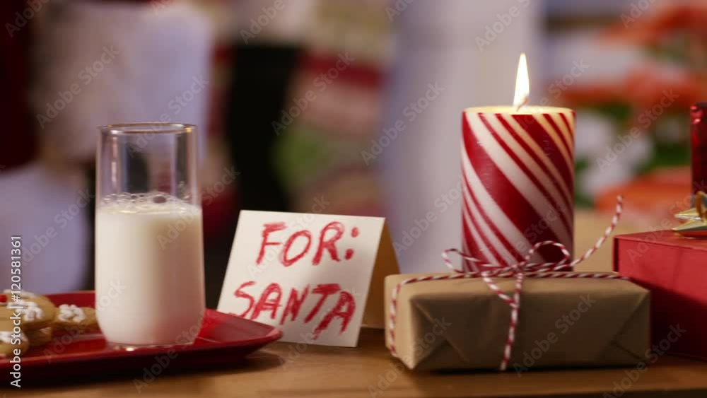 Santa Claus has some milk and cookies