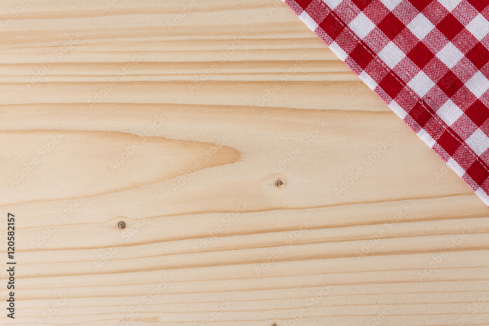 Checkered tablecloth red on the wooden background/ texture Checkered tablecloth red on the wooden background/ texture
