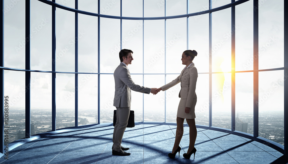 Business partners handshake . Mixed media Business partners handshake . Mixed media