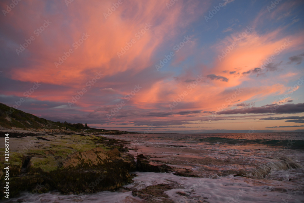 coastline sunset with red clouds 