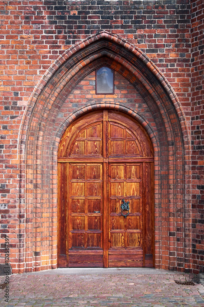 Fototapeta premium Beautifully restored massive double wood door entrance to the Karmeliter monastery in Elsinore Denmark
