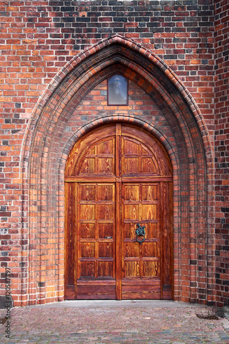Beautifully restored massive double wood door entrance to the Karmeliter monastery in Elsinore Denmark