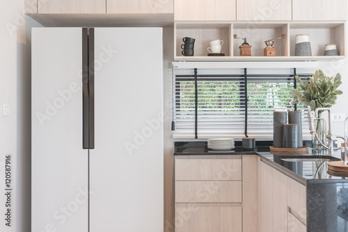 interior design of new decorated wooden kitchen in luxury home