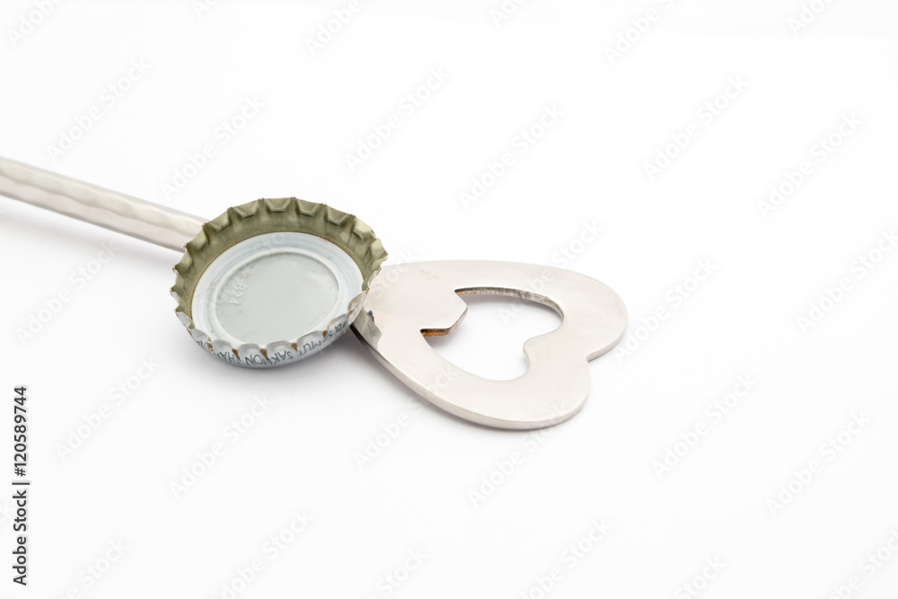 close up of bottle opener and cap on white background with clipp close up of bottle opener and cap on white background with clipp