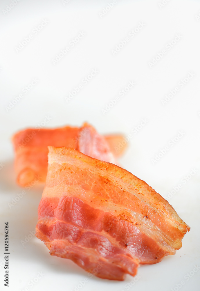 cooked slice of bacon isolated on white