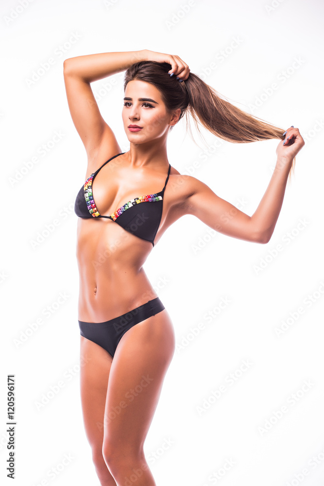 Vivacious sexy young brunette woman with a beautiful smile and posing in a  black bikini isolated studio portrait Stock Photo | Adobe Stock